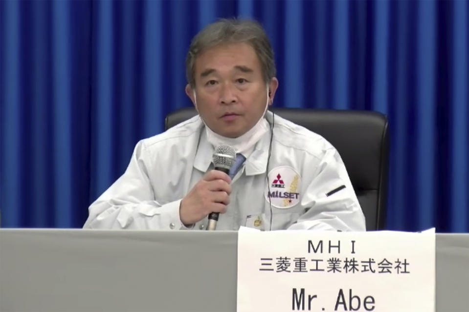 In this image made from a video, Naohiko Abe of Mitsubishi Heavy Industries, Ltd., attends a news conference at Tanegashima Space Center on a small southern Japanese island after a launch of a United Arab Emirates spacecraft Monday, July 20, 2020. A United Arab Emirates spacecraft rocketed away Monday on a seven-month journey to Mars, kicking off the Arab world’s first interplanetary mission. (MHI via AP Photo)