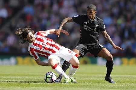 Britain Football Soccer - Stoke City v Liverpool - Premier League - bet365 Stadium - 8/4/17 Stoke City's Joe Allen is challenged by Liverpool's Georginio Wijnaldum Action Images via Reuters / Carl Recine Livepic