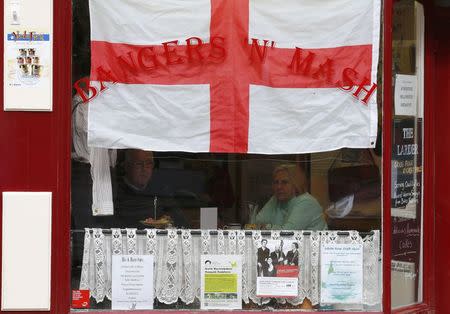 Customers sit in a cafe in Atherstone, central England, March 31, 2015. REUTERS/Darren Staples