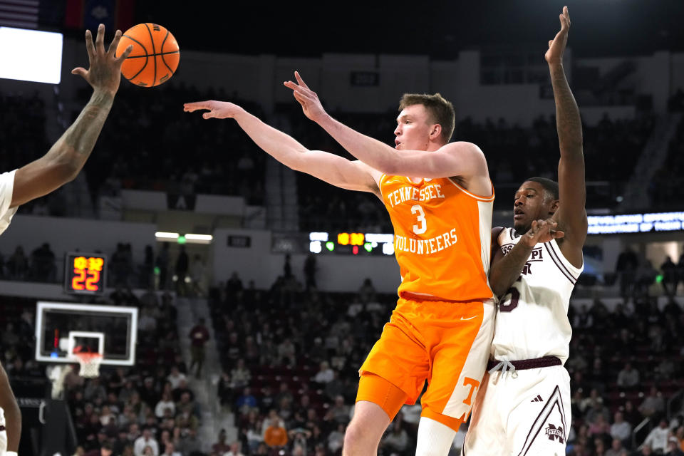 Tennessee guard Dalton Knecht (3) passes off while defended by Mississippi State guard Shawn Jones Jr. (5) during the first half of an NCAA college basketball game, Wednesday, Jan. 10, 2024, in Starkville, Miss. (AP Photo/Rogelio V. Solis)