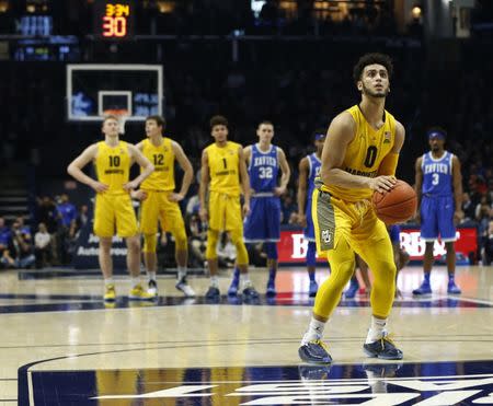 Jan 26, 2019; Cincinnati, OH, USA; Marquette Golden Eagles guard Markus Howard (0) shoots a free throw during the second half against the Xavier Musketeers at the Cintas Center. Mandatory Credit: Frank Victores-USA TODAY Sports