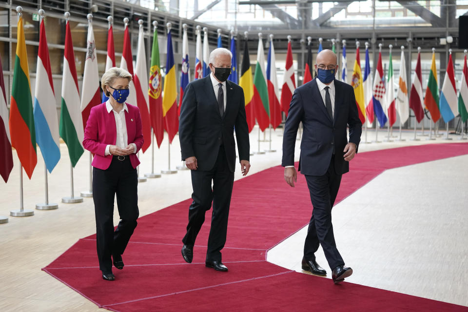 President Joe Biden, center, walks with European Council President Charles Michel, right, and European Commission President Ursula von der Leyen during the United States-European Union Summit at the European Council in Brussels, Tuesday, June 15, 2021. (AP Photo/Patrick Semansky)