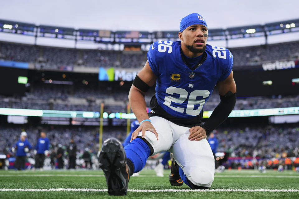 EAST RUTHERFORD, NJ - JANUARY 07: Saquon Barkley #26 of the New York Giants warms up before kickoff against the Philadelphia Eagles at MetLife Stadium on January 7, 2024 in East Rutherford, New Jersey. (Photo by Cooper Neill/Getty Images)