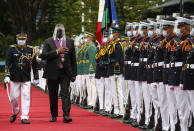 United States Defense Secretary Lloyd Austin, second left, views the military honor guard at Camp Aguinaldo military camp in Quezon City, Metro Manila, Philippines, Friday, July 30, 2021. Austin is visiting Manila to hold talks with Philippine officials to boost defense ties and possibly discuss the The Visiting Forces Agreement between the US and Philippines. (Rolex dela Pena/Pool Photo via AP)