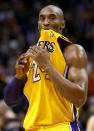 Los Angeles Lakers' Kobe Bryant looks at the crowd during a timeout against the Phoenix Suns during the first half on an NBA basketball game, Wednesday, Jan. 30, 2013, in Phoenix. (AP Photo/Matt York)