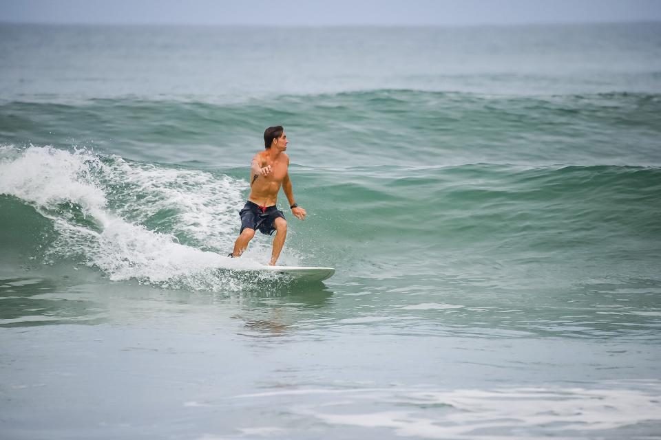 A man surfing with Iguana Surf Vacations