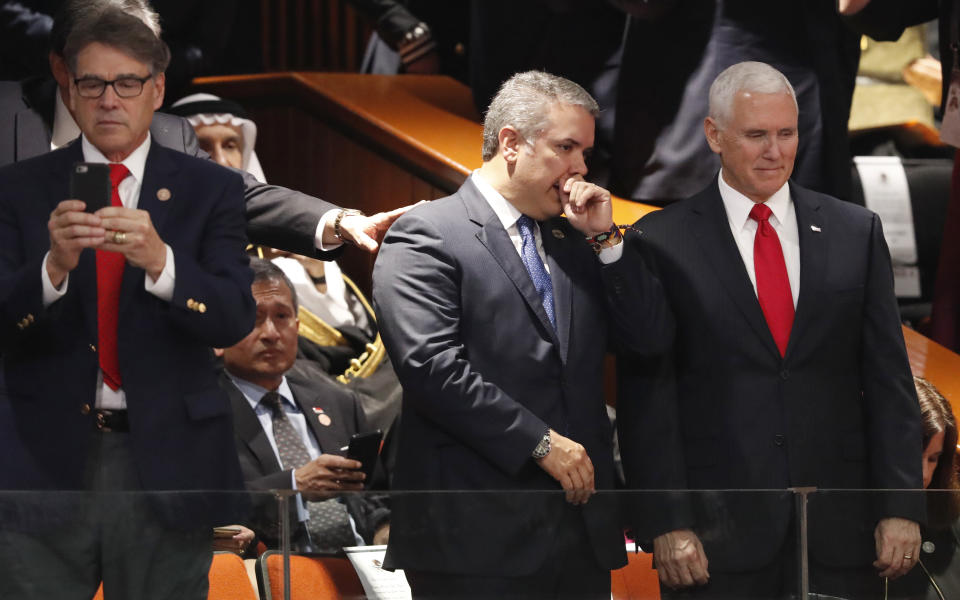 Colombia's President Ivan Duque, center left, and Vice President Mike Pence wait for the start of the inauguration ceremony for President-elect Andres Manuel Lopez Obrador, at the National Congress in Mexico City, Saturday, Dec 1, 2018. The inauguration of Lopez Obrador will mark a turning point in one of the world's most radical experiments in opening markets and privatization. Energy Secretary Rick Perry is pictured left. (AP Photo/Marco Ugarte)