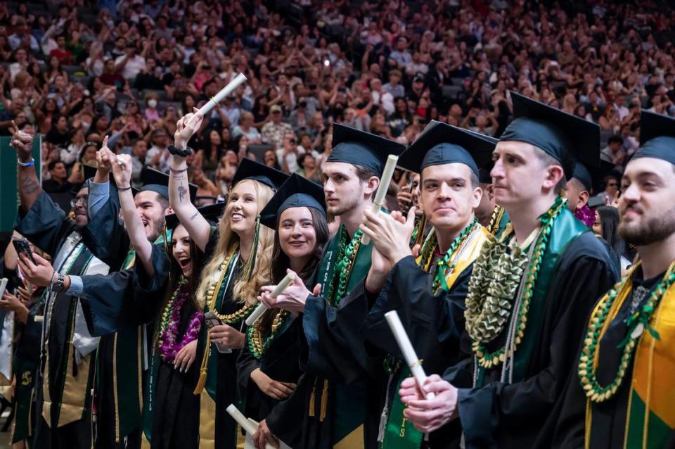 Graduates cheer during the Sacramento State College of Business commencement in May at Golden 1 Center. It was the final set of graduation ceremonies for retiring President Robert S. Nelsen.