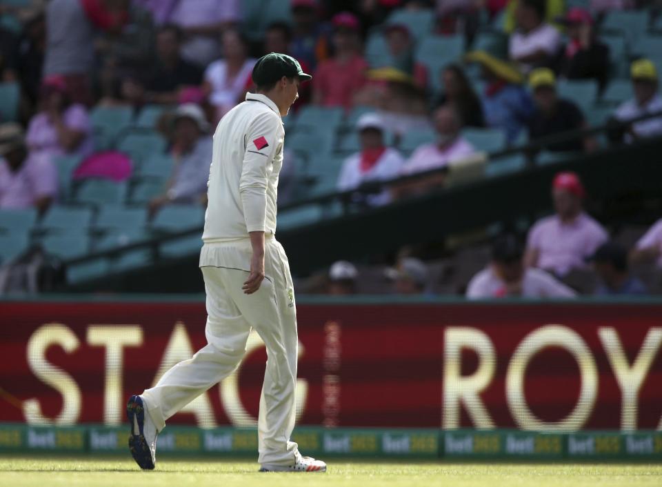 In this Jan. 5, 2017, photo Australia's Matt Renshaw leaves the field of play shortly after he was hit with a batted ball during their cricket test match against Pakistan in Sydney, Australia. Renshaw has been ruled out for the remainder of the third test against Pakistan due to concussion after being hit on the helmet twice in three days at the Sydney Cricket Ground. (AP Photo/Rick Rycroft)