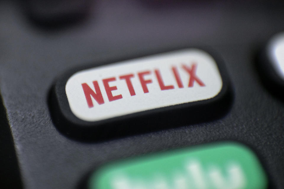 FILE - This Aug. 13, 2020 file photo shows a logo for Netflix on a remote control in Portland, Ore. Streaming services ranging from Netflix to Disney+ want us to stop sharing passwords. That's the new edict from the giants of streaming media, who hope to discourage the common practice of sharing account passwords without alienating their subscribers, who've grown accustomed to the hack. (AP Photo/Jenny Kane, File)