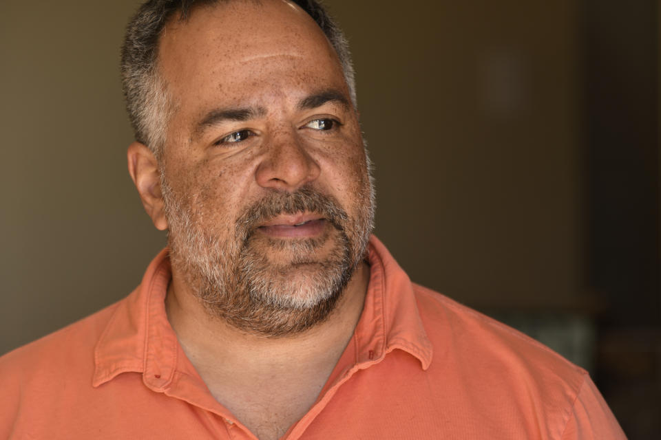 Isaac Foster, co-founder and chairman of Portland Cannabis Market, a wholesale distributor, sits for a portrait in his Denver on March 28, 2023. Along the West Coast, which has dominated U.S. marijuana production from long before legalization, producers are struggling with what many call the failed economics of legal pot — a challenge inherent in regulating a product that remains illegal under federal law.(AP Photo/Thomas Peipert)