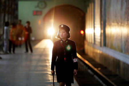 A subway worker walks away after a train departed the station in central Pyongyang, North Korea May 7, 2016. REUTERS/Damir Sagolj/File Photo