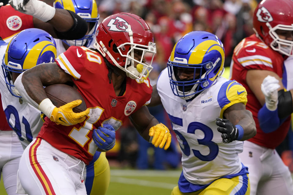 Kansas City Chiefs running back Isiah Pacheco (10) runs from Los Angeles Rams linebacker Ernest Jones (53) during the first half of an NFL football game Sunday, Nov. 27, 2022, in Kansas City, Mo. (AP Photo/Ed Zurga)