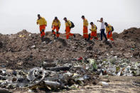 Volunteers of Israeli rescue and recovery organisation ZAKA search for remains of Ethiopian Airlines Flight ET 302 plane crash victims at the scene of a plane crash, near the town of Bishoftu, southeast of Addis Ababa, Ethiopia March 12, 2019. REUTERS/Baz Ratner