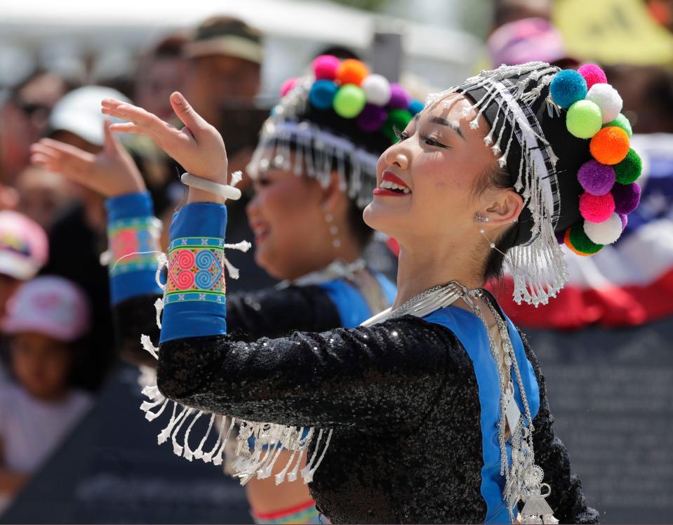 A member of the Lunabellas Hmong dance group performs during the 2023 Memorial Day program at the Lao, Hmong and American Veterans Memorial in Sheboygan.