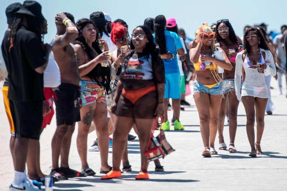 Spring breakers enjoy the weather at Biloxi Beach during Black Spring Break in Biloxi on Saturday, April 13. Some organizers of spring break events said the treatment of spring breakers by law enforcement was racist.