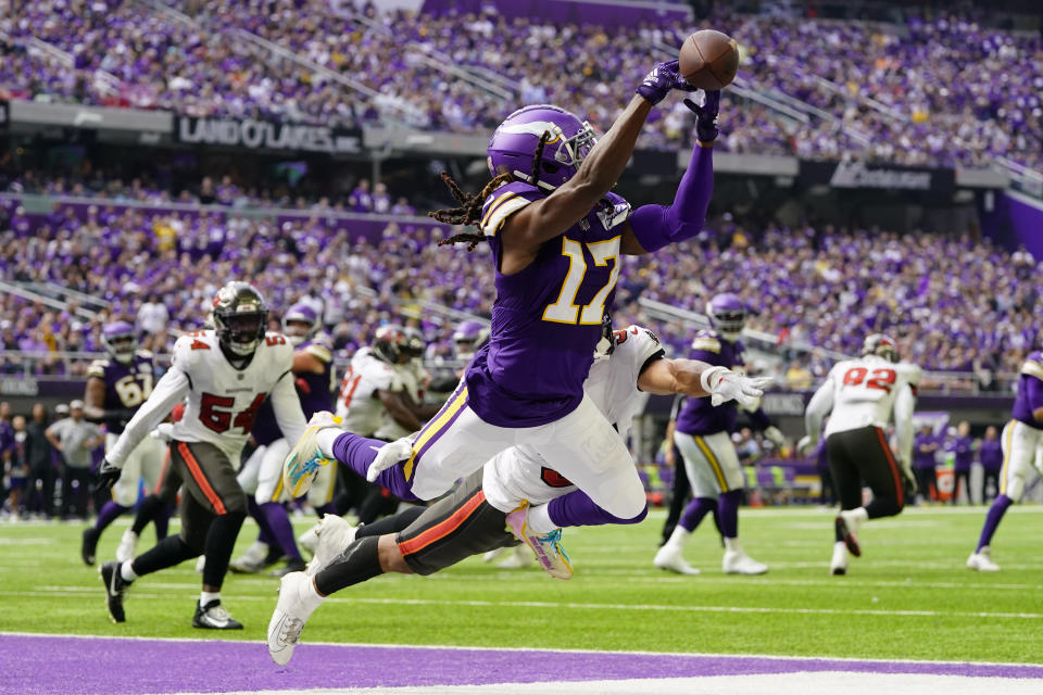 Minnesota Vikings wide receiver K.J. Osborn (17) reaches for an incomplete pass during the first half of an NFL football game against the Tampa Bay Buccaneers, Sunday, Sept. 10, 2023, in Minneapolis. (AP Photo/Abbie Parr)