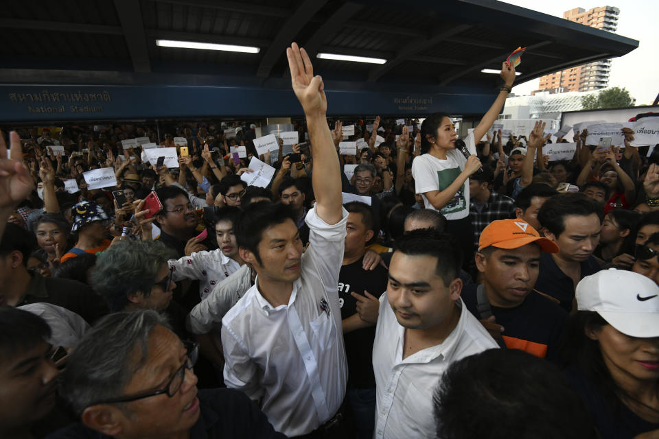 Thailand's Future Forward Party leader Thanathorn Juangroongruangkit gestures as he talks to his supporters during rally in Bangkok, Thailand, Saturday, Dec. 14, 2019. Several thousand supporters of a popular Thai political party, under threat of dissolution, packed a concourse in central Bangkok on Saturday in one of the largest political demonstrations in recent years. (AP Photo/Str)