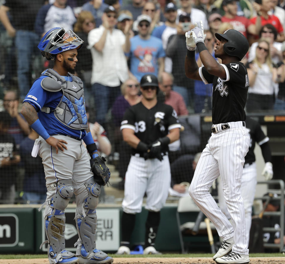 Chicago White Sox's Tim Anderson, right, celebrates after hitting a two-run home run as Kansas City Royals catcher Martin Maldonado looks to the field during the fourth inning of a baseball game in Chicago, Wednesday, April 17, 2019. (AP Photo/Nam Y. Huh)