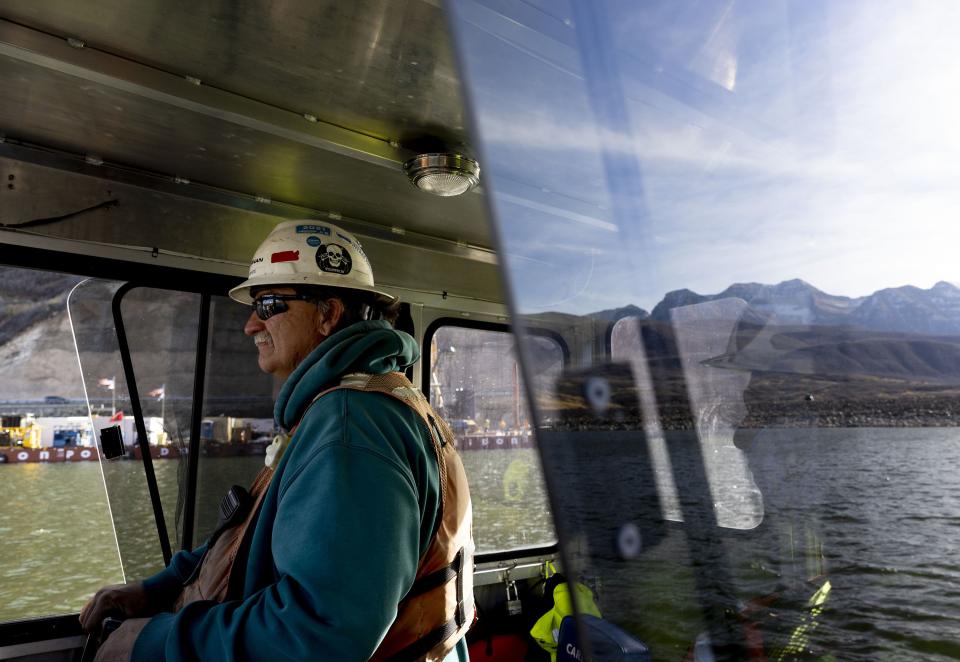 Boat Pilot Dan White shuttles construction workers to and from the Deer Creek Intake Project in Heber City on Wednesday, Nov. 15, 2023. | Laura Seitz, Deseret News