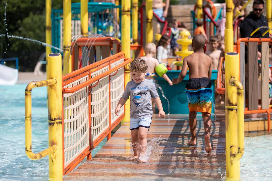 Children play on and near the newest pool feature at the Woodland Aquatic Center: Paradise Lagoon, a shipwreck-themed feature at Woodland Aquatic Center at Woodland Park in Lexington, Ky., Friday, May 26, 2023.