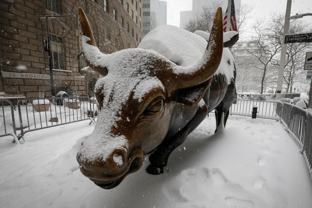 The Charging Bull statue is seen during a snow storm in the Manhattan borough of New York City, New York, U.S., February 1, 2021.  REUTERS/Brendan McDermid