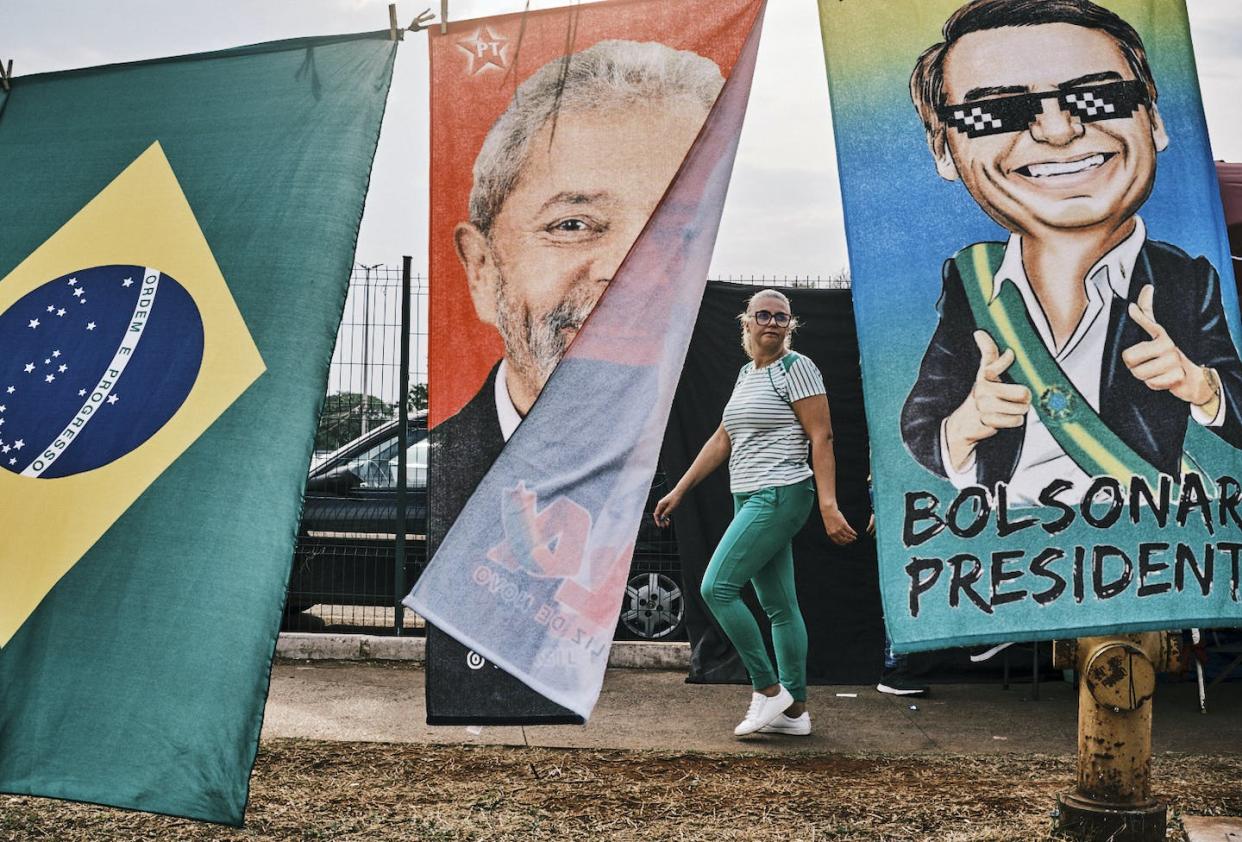 Winds of change in Brazil, or an ill breeze? <a href="https://www.gettyimages.com/detail/news-photo/woman-walks-by-flags-of-presidential-candidates-luiz-inacio-news-photo/1243393711?adppopup=true" rel="nofollow noopener" target="_blank" data-ylk="slk:Gustavo Minas/Getty Images;elm:context_link;itc:0;sec:content-canvas" class="link ">Gustavo Minas/Getty Images</a>