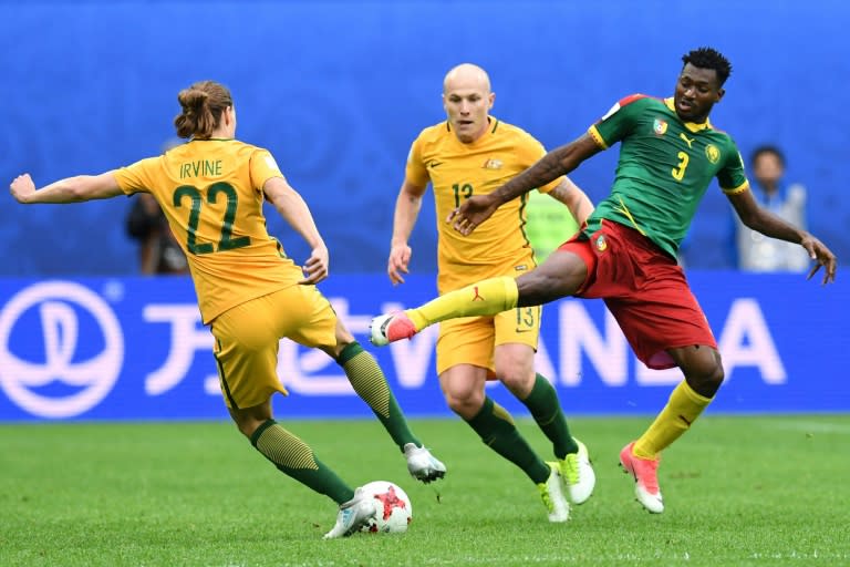 Australia's midfielder Jackson Irvine (L) vies for the ball against Cameroon's midfielder Andre Zambo during the 2017 Confederations Cup group B football match between Cameroon and Australia, which resulted in a draw