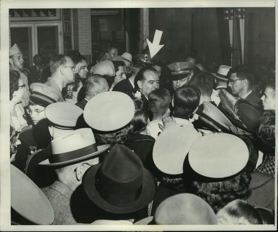 Sen. Joseph McCarthy (marked with an arrow) is mobbed by young autograph seekers after he addresses a gathering of about 2,000 people at at an event marking the 100th anniversary of the founding of the Republican Party in Ripon on June 5, 1954.