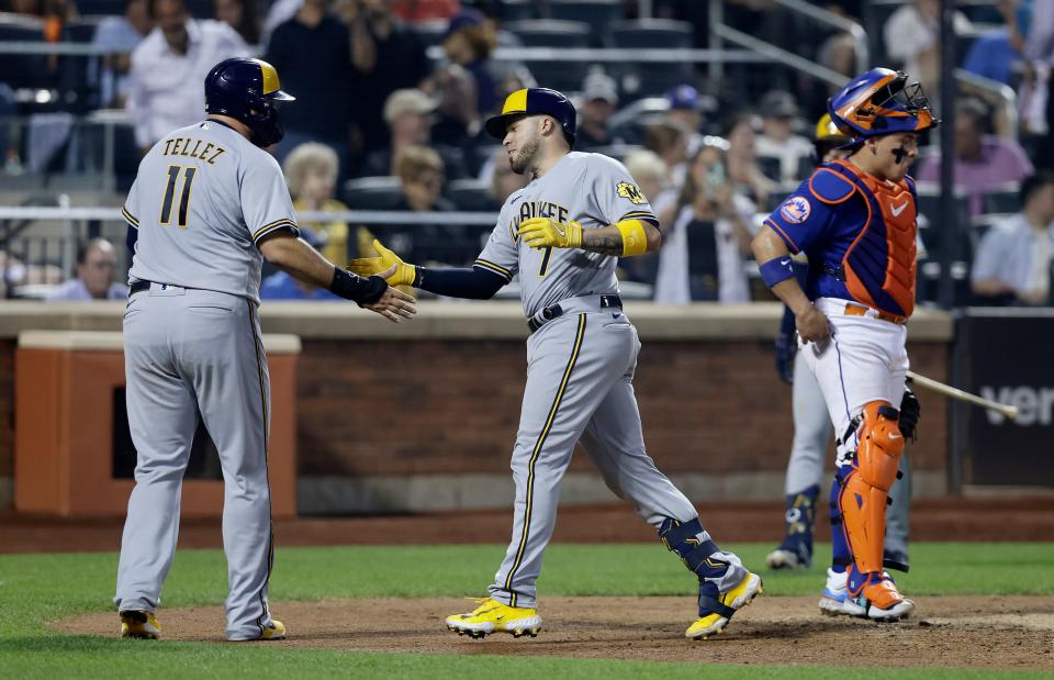 NEW YORK, NEW YORK - JUNE 29:  Victor Caratini #7 of the Milwaukee Brewers celebrates his sixth inning two run home run with teammate Rowdy Tellez #11 as Francisco Alvarez #4 of the New York Mets looks on at Citi Field on June 29, 2023 in New York City. (Photo by Jim McIsaac/Getty Images)