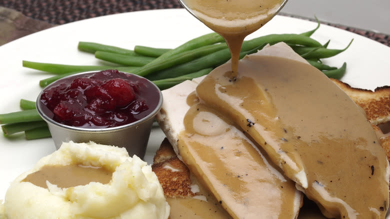 turkey gravy pouring potatoes 