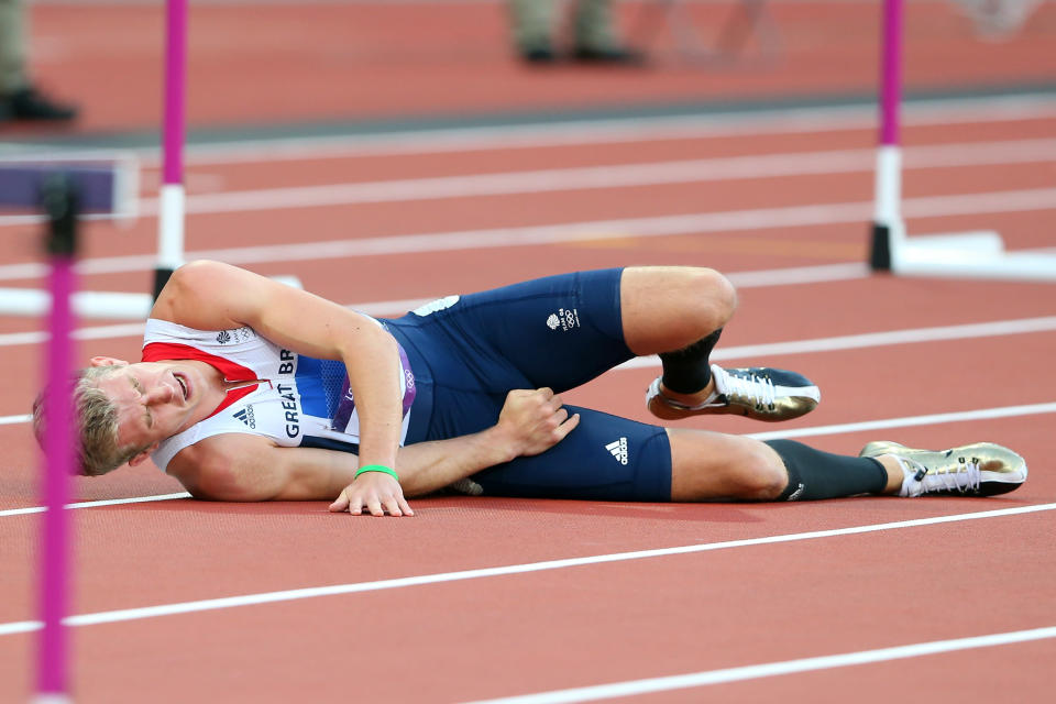 LONDON, ENGLAND - AUGUST 04: Jack Green of Great Britain lies after falling in the Men's 400m Hurdles Semi Final on Day 8 of the London 2012 Olympic Games at Olympic Stadium on August 4, 2012 in London, England. (Photo by Alexander Hassenstein/Getty Images)