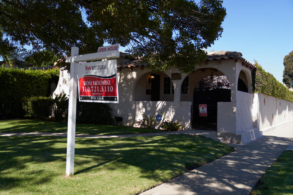 LOS ANGELES, CA - SEPTEMBER 22: A 'for sale' sign is displayed outside a single family home on September 22, 2022 in Los Angeles, California. The U.S. housing market is seeing a slow down in home sales due to the Federal Reserve raising mortgage interest rates to help fight inflation. (Photo by Allison Dinner/Getty Images)