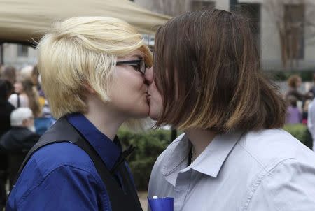 Britain Cook and Heather Bowling kiss after getting married in a park outside Jefferson County Courthouse in Birmingham, Alabama February 9, 2015. REUTERS/Marvin Gentry