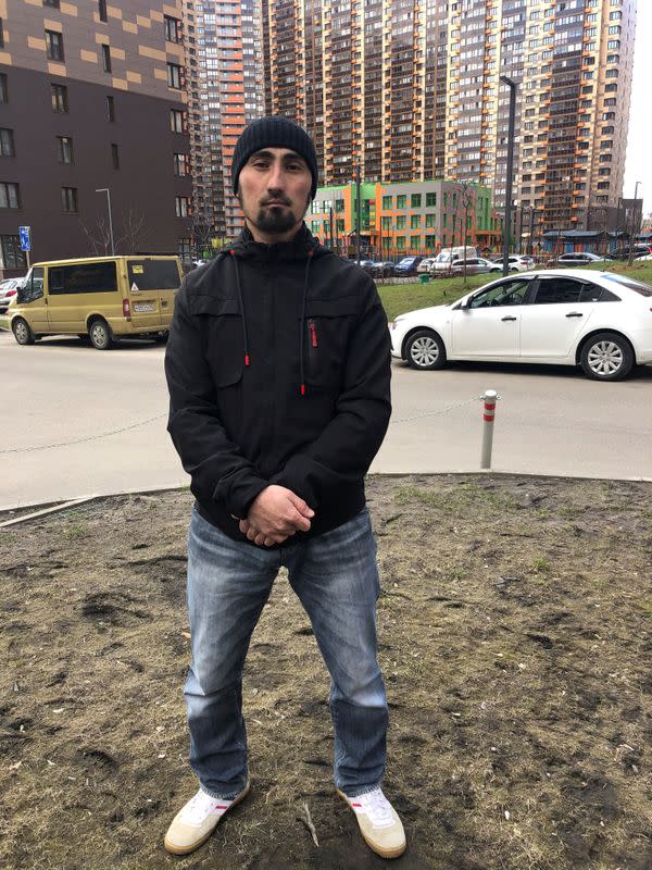 Ibragim Artykov, builder from Tajikistan, poses for a picture during an interview in Moscow