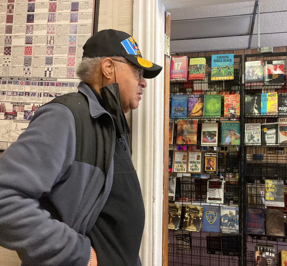 Larry Miles stands in the hallway of his Camden bookstore. The 88-year-old started a GoFundMe to keep the store in business; he hopes to eventually open a history museum in Camden highlighting African, African American and Camden history.