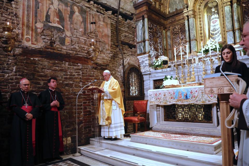 Pope Francis prays inside the shrine containing a small house traditionally venerated as the house of Mary, and believed miraculously transplanted from the Holy Land inside the Basilica of Our Lady of Loreto, in central Italy, where Francis is paying a one-day visit, Monday, Mar. 25, 2019. The pope chose Loreto to sign the Post-Synodal Exhortation of last October's Synod of Bishops. (AP Photo/Domenico Stinellis)