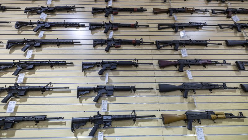 AR-15 and AK-47 rifles are displayed on a wall at Impact Guns in South Salt Lake on July 6, 2022. Republicans sponsored and passed approximately a dozen bills concerning firearms during the 2023 legislative session. 