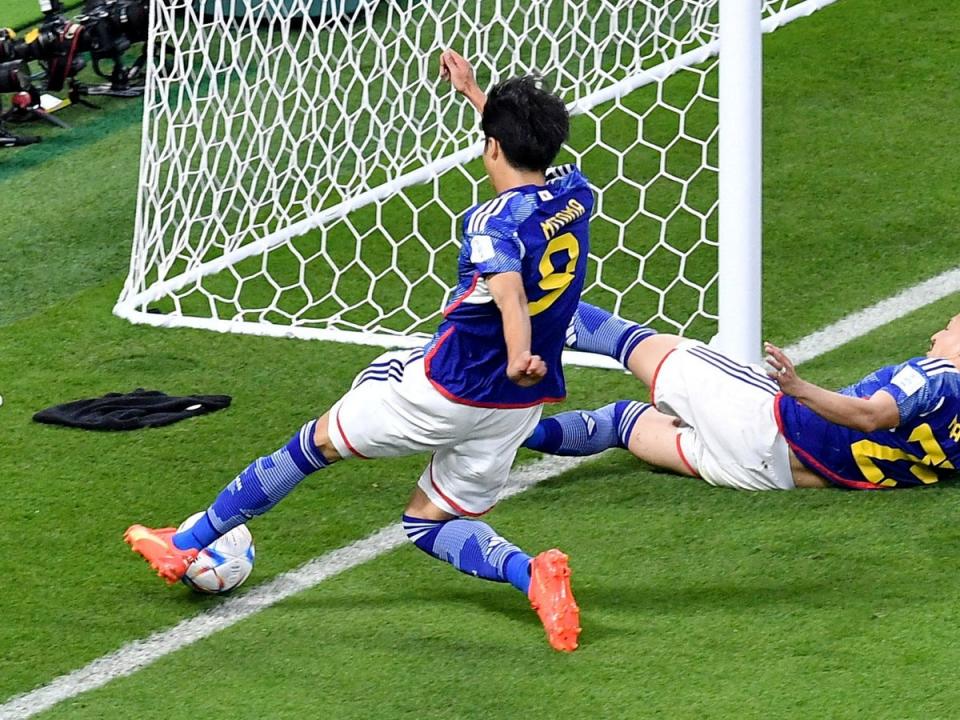 Japan's Kaoru Mitoma in action as the ball appears to cross the line before Japan's Ao Tanaka scores (REUTERS)
