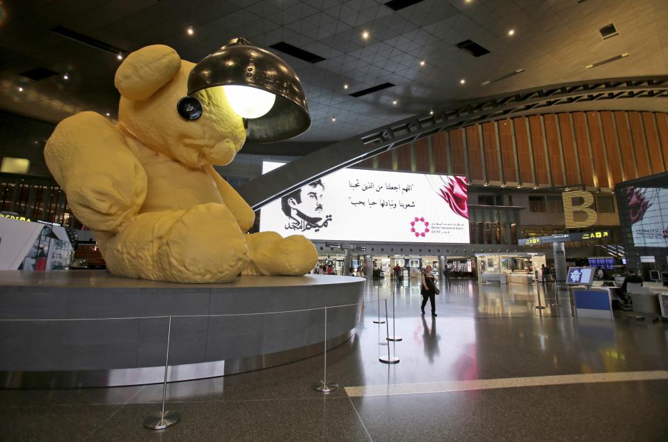 FILE - A giant teddy bear adorns the Hamad International Airport in Doha, Qatar, May 6, 2018. As many as 1.7 million people could pour into Qatar during the upcoming 2022 FIFA World Cup that begins this November — representing over half the population of this small, energy-rich Arab nation. (AP Photo/Kamran Jebreili, File)