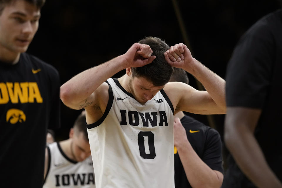 Iowa forward Filip Rebraca (0) walks off the court after an NCAA college basketball game against Nebraska, Sunday, March 5, 2023, in Iowa City, Iowa. Nebraska won 81-77. (AP Photo/Charlie Neibergall)