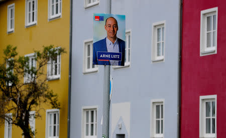An election campaign poster of Arne Lietz, candidate of the Social Democratic Party (SPD) for the upcoming European Parliament elections is pictured in Halberstadt, Germany, May 4, 2019. Picture taken May 4, 2019. REUTERS/Fabrizio Bensch