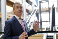 Britain's Nigel Farage, the leader of the Brexit Party, answers reporters at the European parliament Tuesday, Jan.14, 2020 in Strasbourg, eastern France. (AP Photo/Jean-Francois Badias)