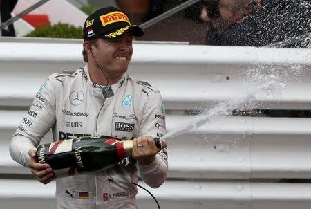 Mercedes Formula One driver Nico Rosberg of Germany sprays champagne after winning the Monaco F1 Grand Prix in Monaco May 24, 2015. REUTERS/Stefano Rellandini