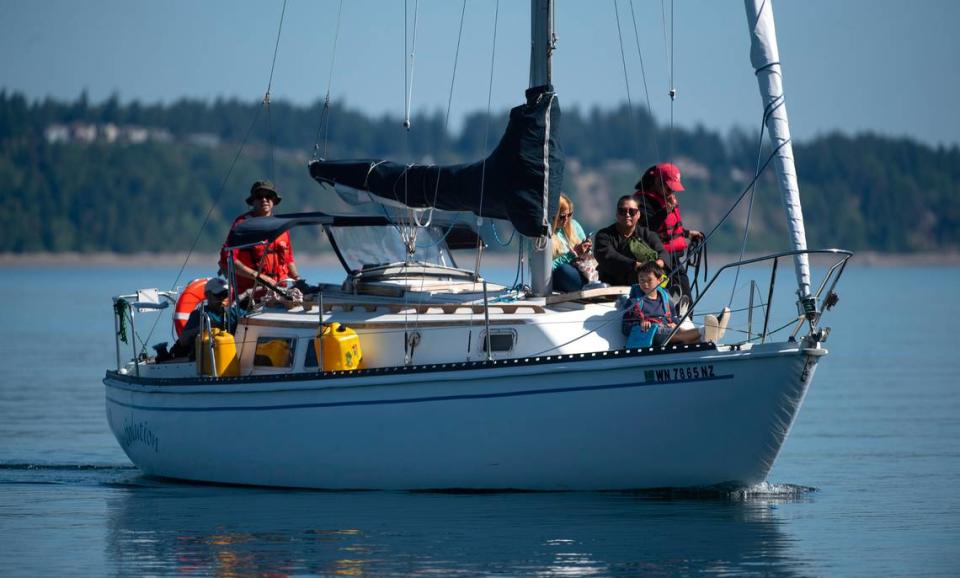 Captain Corey Feldon (far left) and his sailboat “Solution” are Anderson Island’s solution to a down ferry, where Feldon steps in to shuttle people, dogs - and even guinea pigs - to and from the island. Feldon is shown arriving with passengers at Steilacoom after the ferry broke down on Saturday, June 3, 2023.