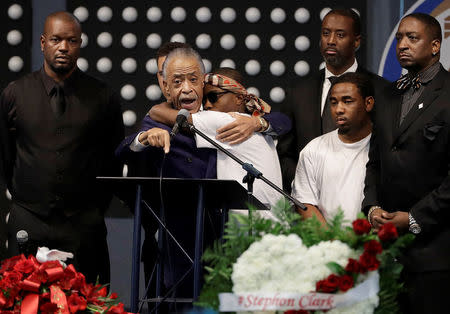 Rev. Al Sharpton (L), speaks next to Stevante Clark during the funeral services for police shooting victim Stephon Clark at Bayside Of South Sacramento Church in Sacramento, California, U.S., March 29, 2018. Jeff Chiu/Pool via Reuters