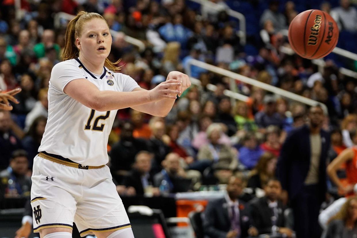 Mar 9, 2019; Greensboro , NC, USA; Notre Dame Fighting Irish guard Abby Prohaska (12) passes off to a teammate against the Syracuse Orange during the second half in the women's ACC Conference Tournament at Greensboro Coliseum. Mandatory Credit: Jim Dedmon-USA TODAY Sports