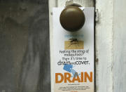 <p>A flyer is left on the doorknob of a home by an inspector from the Miami-Dade County Mosquito Control department, Tuesday, June 21, 2016, in Miami. (AP Photo/Lynne Sladky)</p>