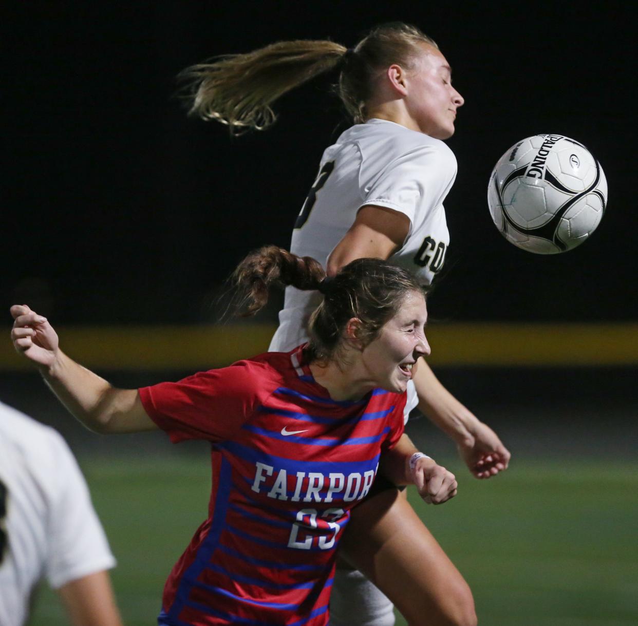 Rush-Henrietta's Mallory Johnson and Fairport's Andrea Wilson both go for a head ball.