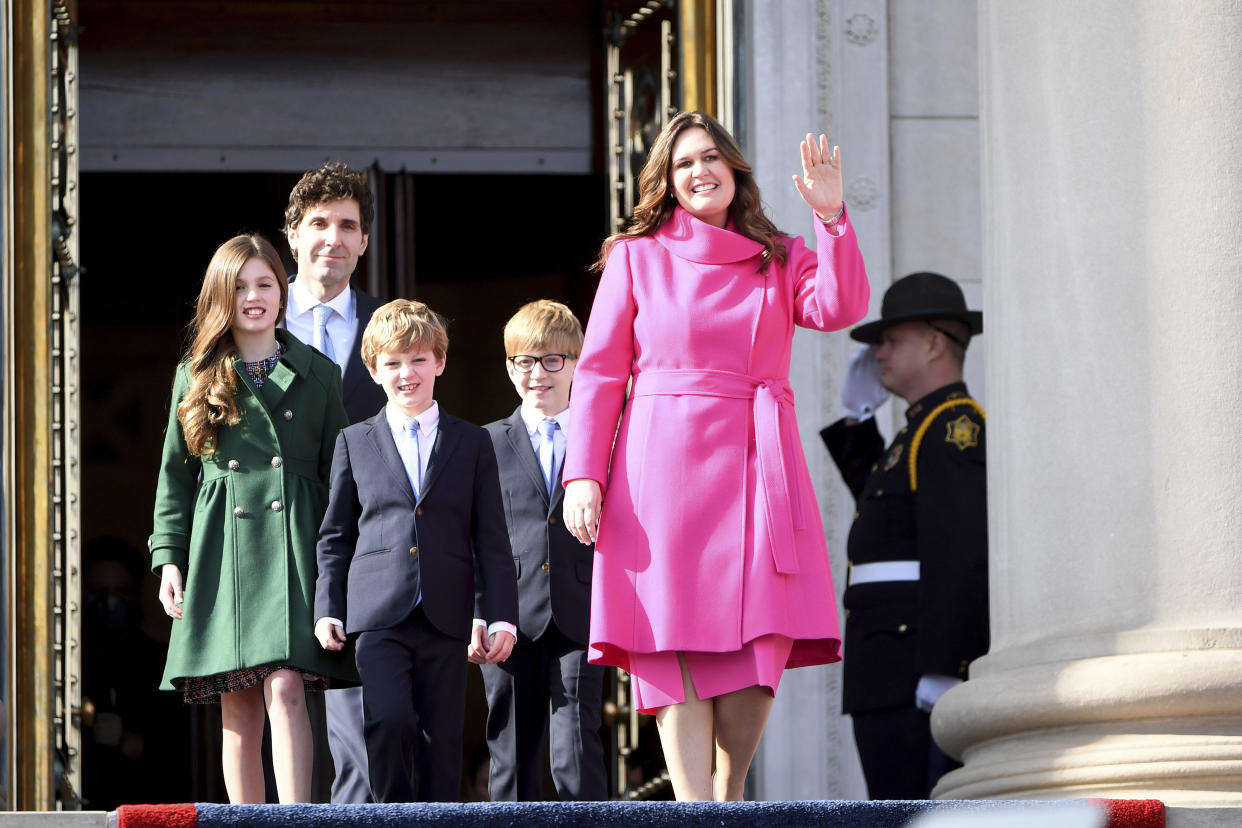 Arkansas governor-elect Sarah Huckabee Sanders is introduced with husband Brian, and children Scarlett, George, and Huck prior to taking the oath of the office on the steps of the Arkansas Capitol Tuesday, Jan. 10, 2023, in Little Rock, Ark. (AP Photo/Will Newton)